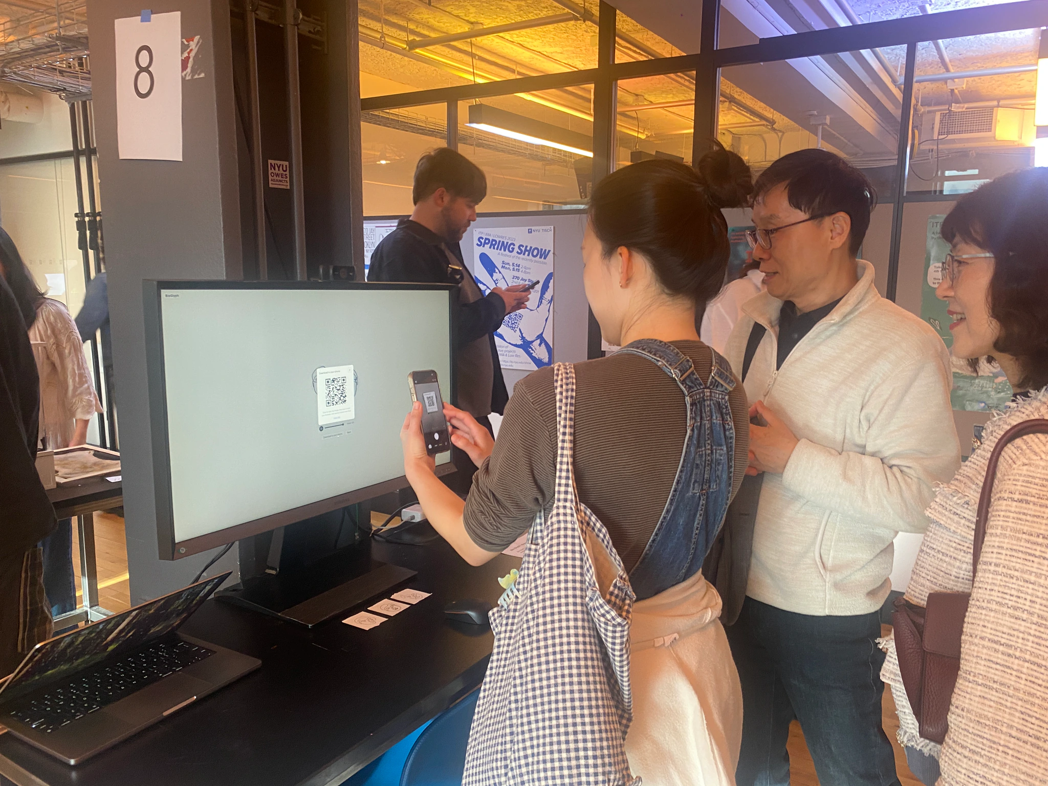 Visitor scanning the BioGlyph QR code at ITP Spring Show 2026